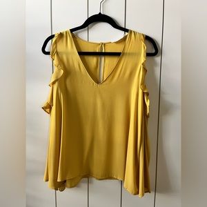 Mustard Yellow blouse w ruffle shoulder cut out. Worn twice. No stains or rips